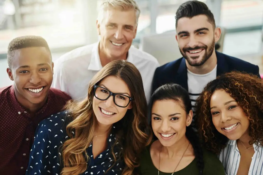 Portrait of a group of confident businesspeople standing together in an office.