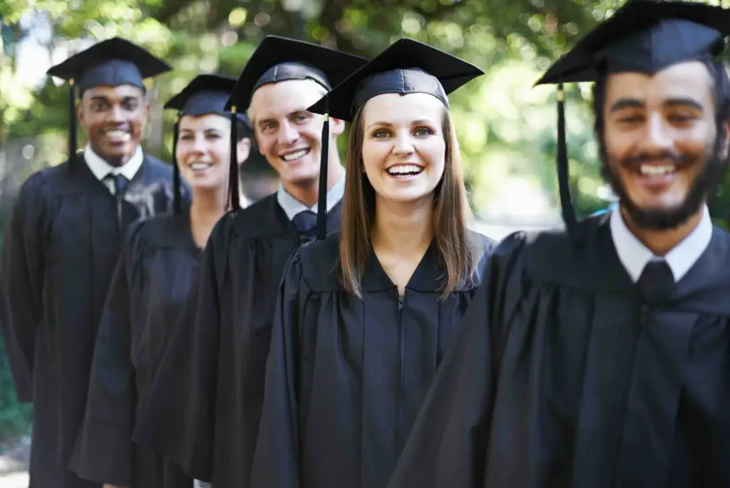 Theyre proud graduates. A group of happy students on graduation day.